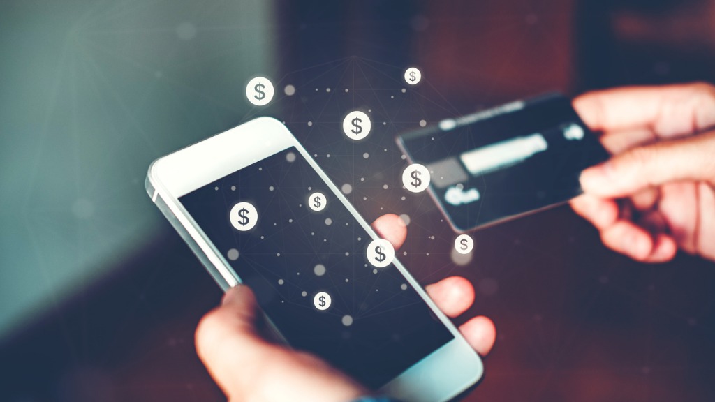 Online banking businessman using smartphone with credit card fintech picture id929878630