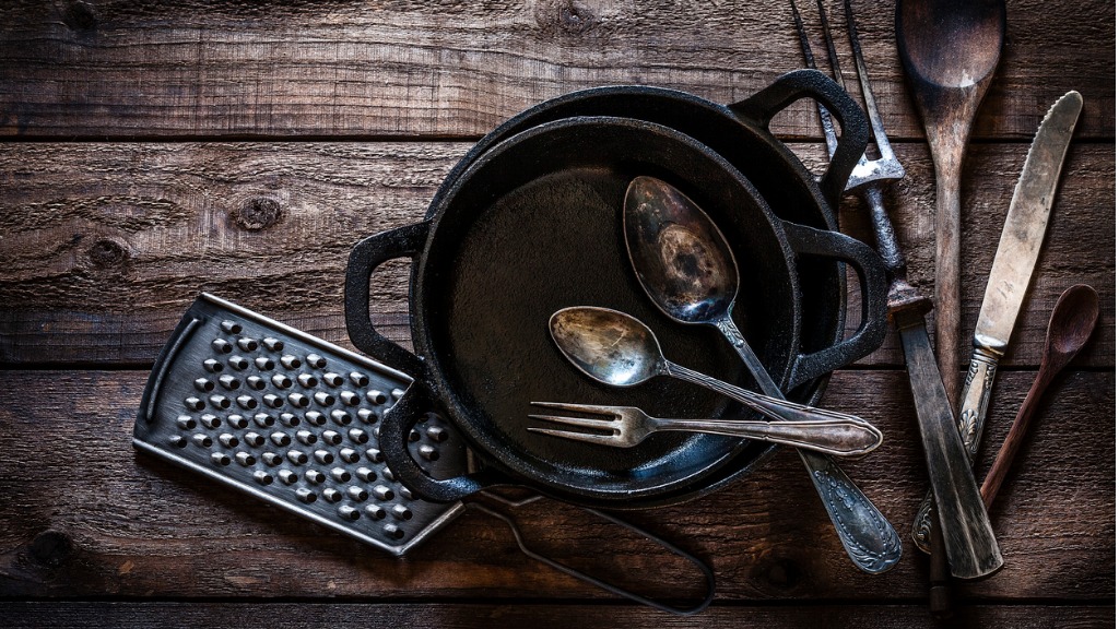Vintage kitchen utensils shot from above on rustic wooden table picture id912245274